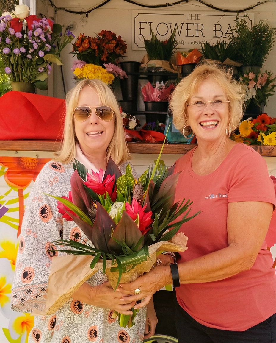 Shirley, founder of The Flower Truck, in a sunlit floral studio